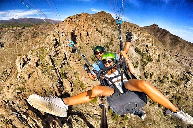 GOLD paragliding flight including videos/photos, t-shirt and a bottle of Cava - Getting ready with a harness, helmet, and GoPro