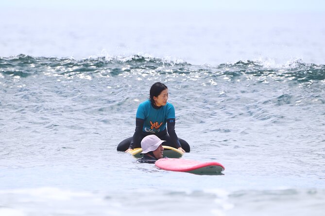 Group Surf Class in Playa de Las Américas with Photographs - Warm-up, equipment, and the short walk to the beach
