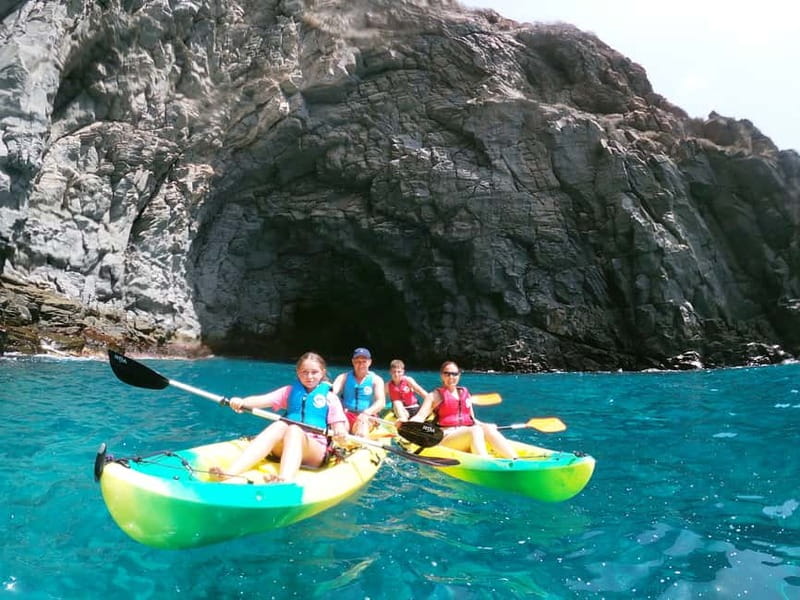 Los Cristianos: Kayak and Snorkel with Turtles and Photos - Entering a sea cave and stopping to snorkel