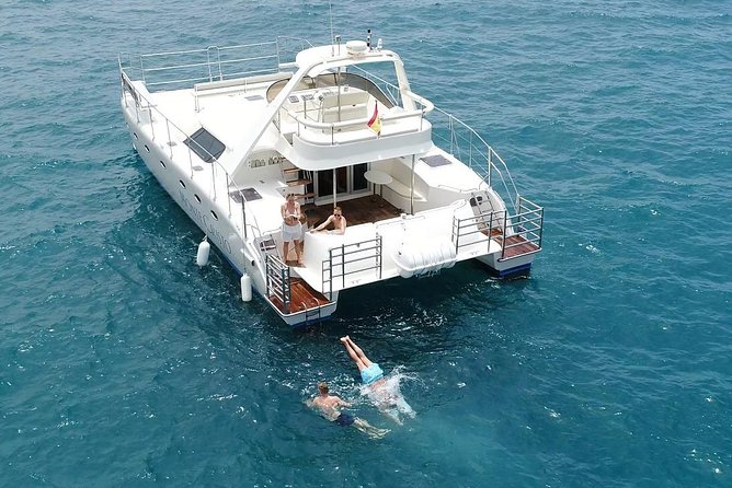 Private Catamaran Charter with Transfer, Buffet and Snorkeling - Swimming and snorkeling along the coast