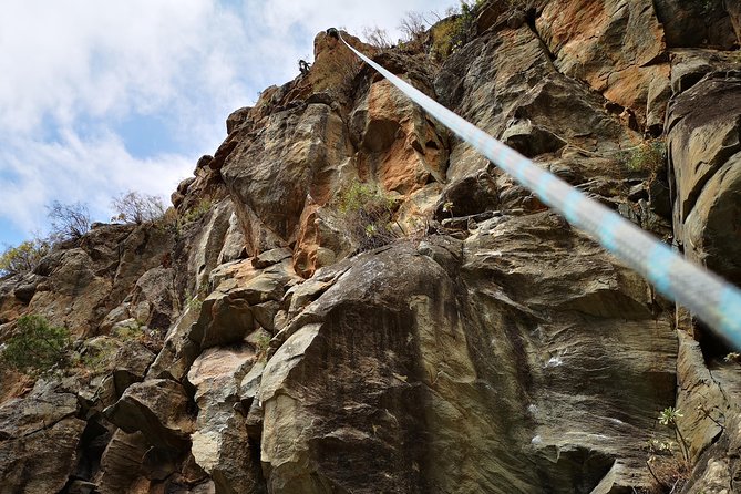Rock climbing in natural space. - A small group and a calm safety system